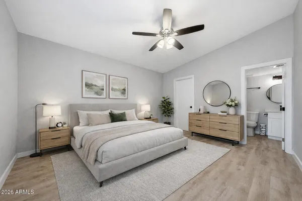 a bedroom with a bed and a dresser