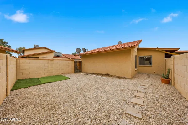 a backyard of a house with a yard and garage