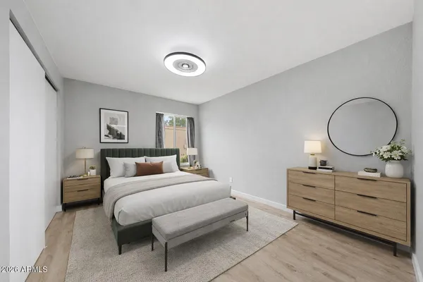 a bedroom with a bed and a dresser