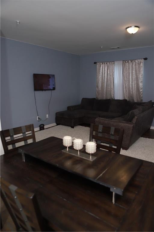 11900 Fuller Street Hampton, GA 30228 - Photo 4 of 17 a living room with furniture and wooden floor