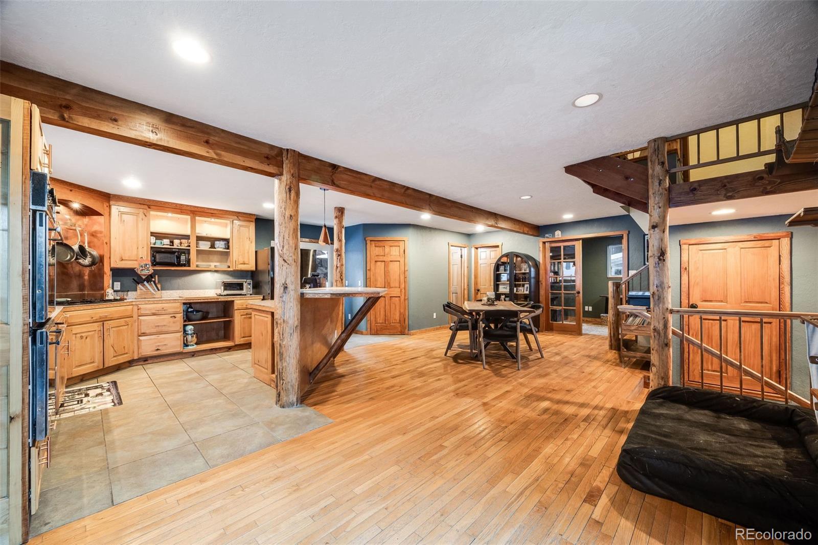 46 Apache Road Evergreen, CO 80439 - Photo 12 of 46 a living room with furniture and a wooden floor