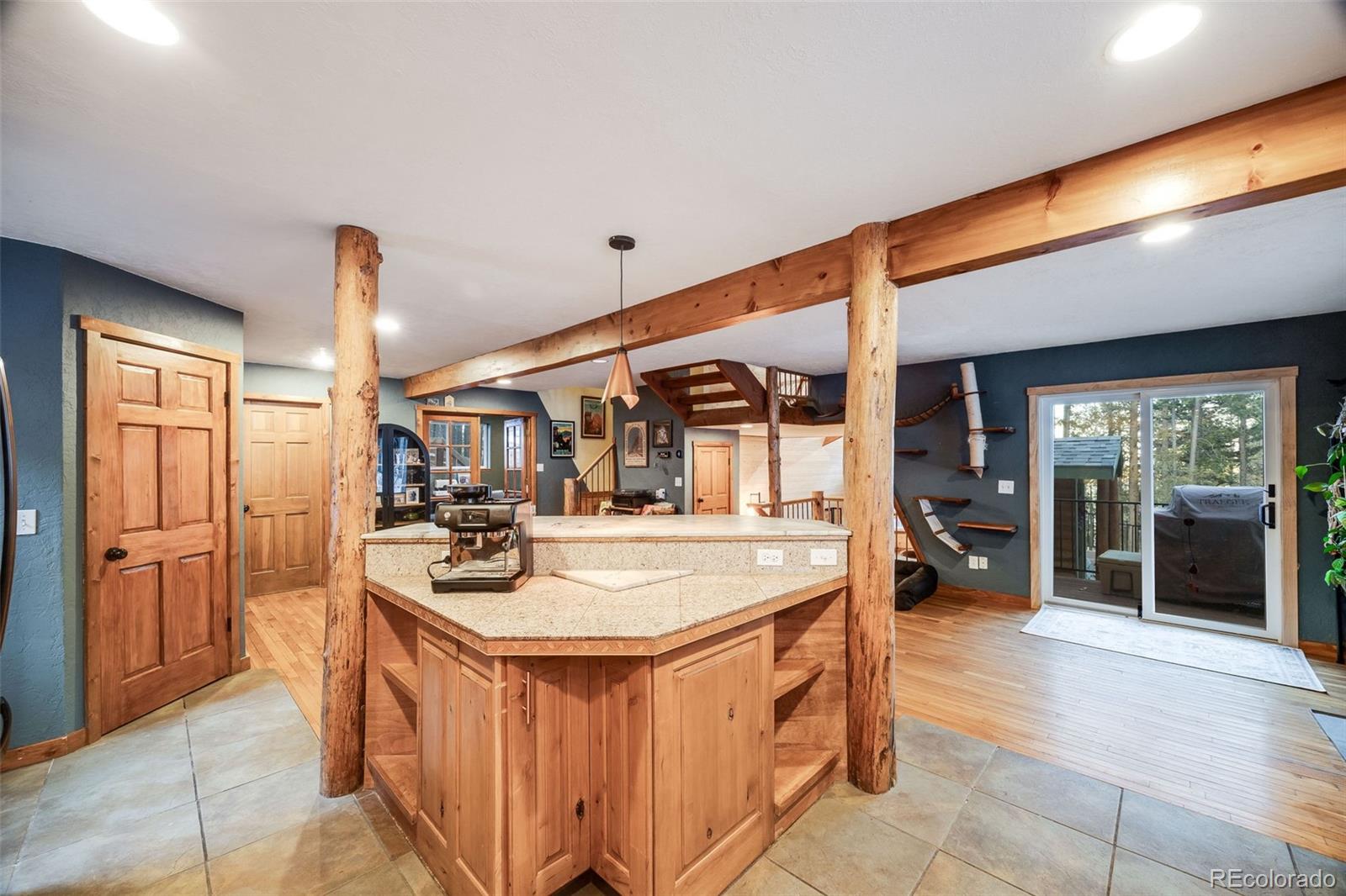 46 Apache Road Evergreen, CO 80439 - Photo 16 of 46 a dining hall with stainless steel appliances granite countertop a stove and a sink
