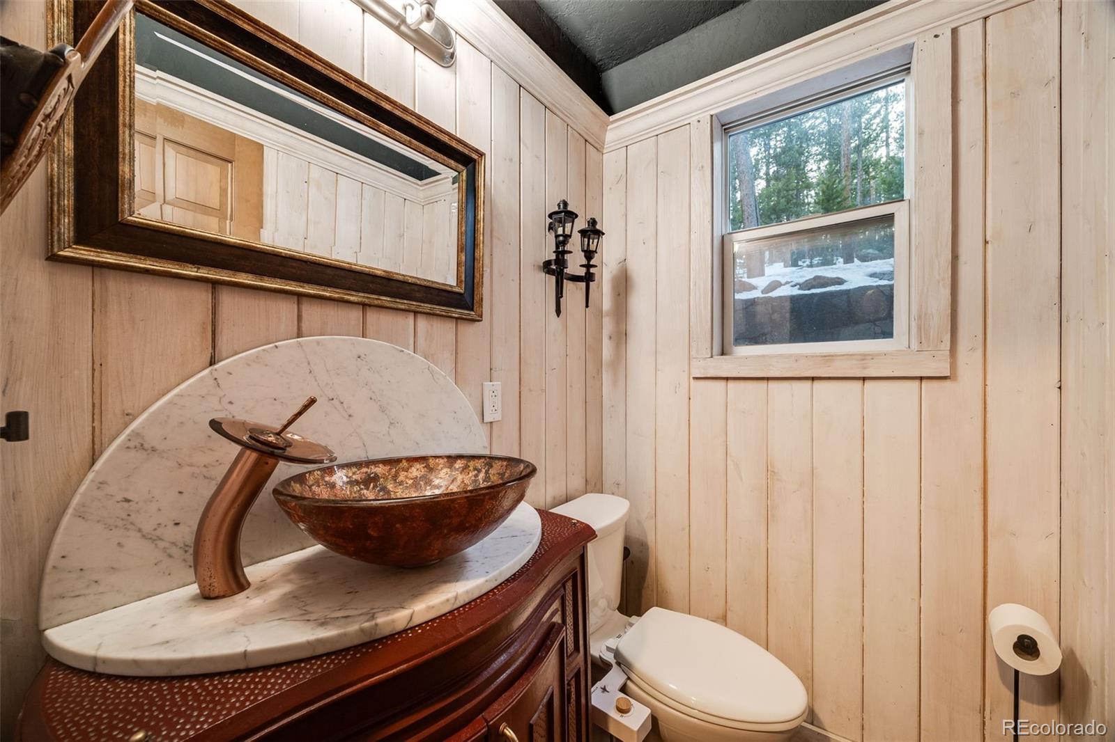 46 Apache Road Evergreen, CO 80439 - Photo 18 of 46 a view of a hallway with furniture and front door