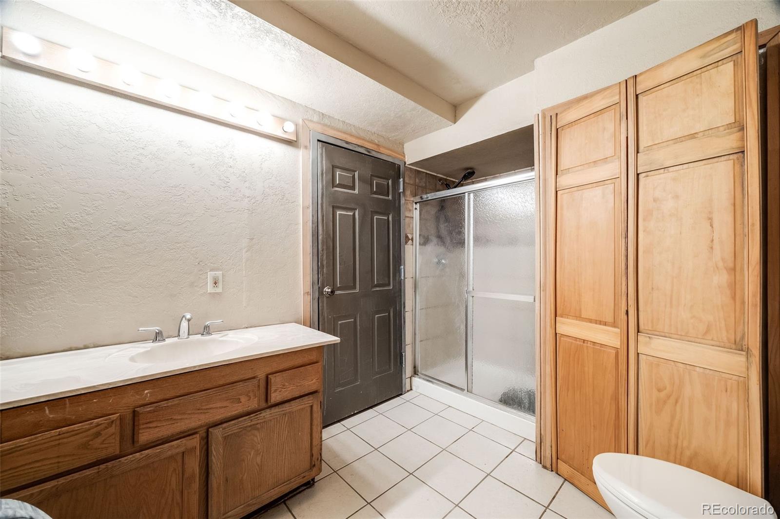 46 Apache Road Evergreen, CO 80439 - Photo 21 of 46 a bathroom with a sink and a mirror