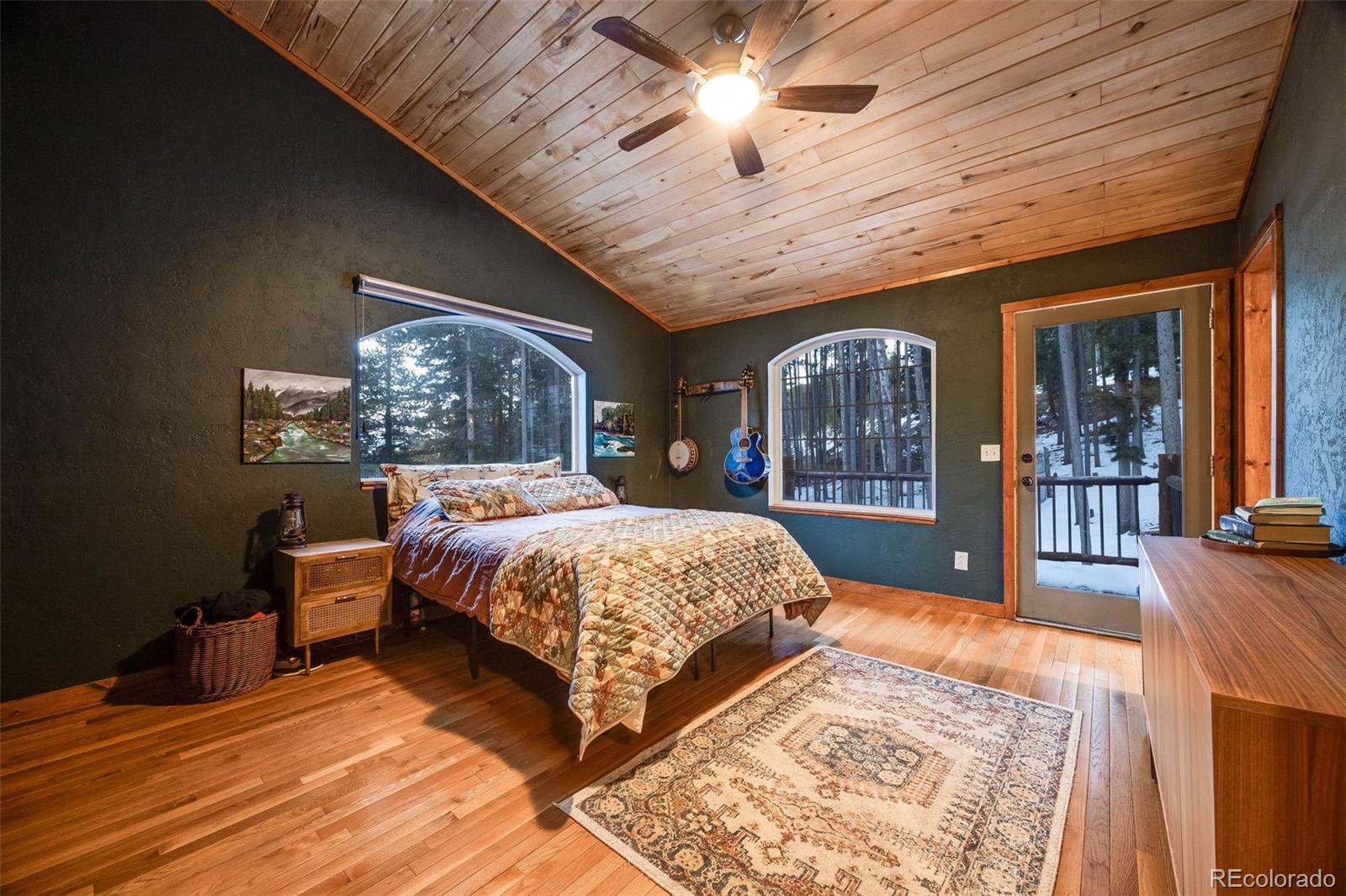 46 Apache Road Evergreen, CO 80439 - Photo 26 of 46 a bed sitting in a spacious bedroom next to a window