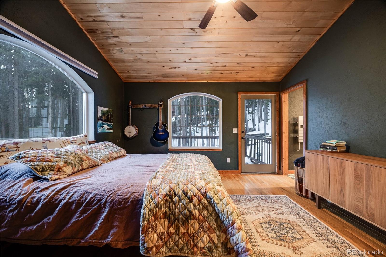 46 Apache Road Evergreen, CO 80439 - Photo 27 of 46 a bed sitting in a bedroom next to a window