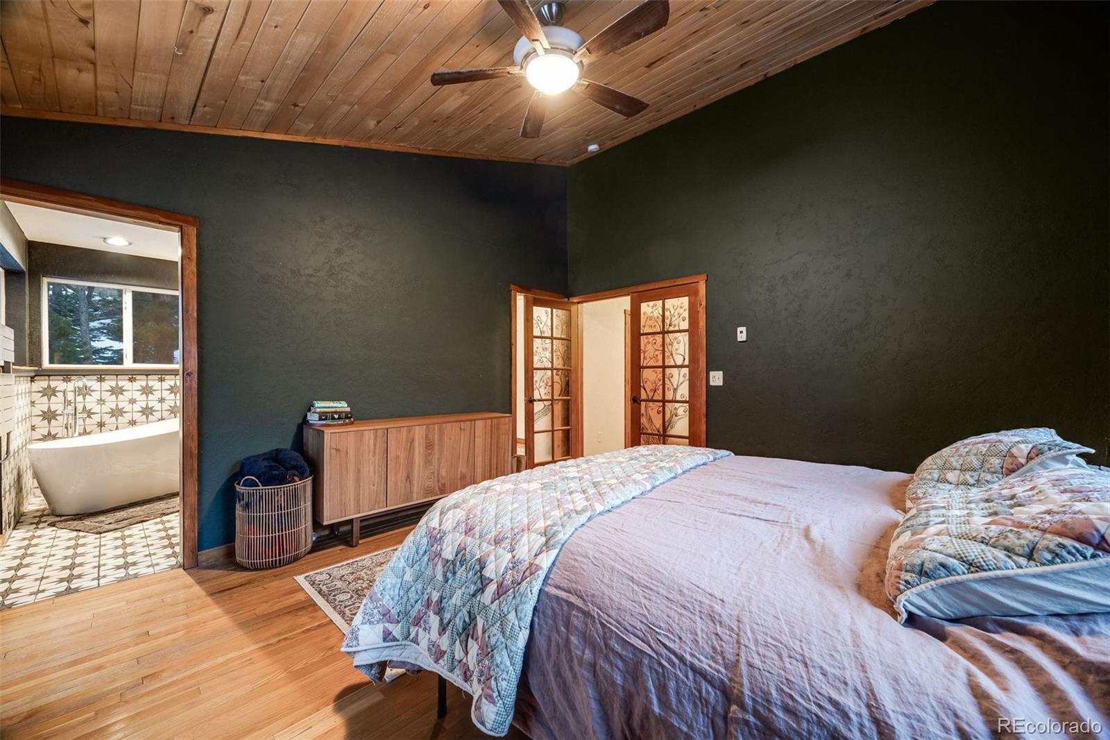 46 Apache Road Evergreen, CO 80439 - Photo 28 of 46 a bedroom with a bed and a window