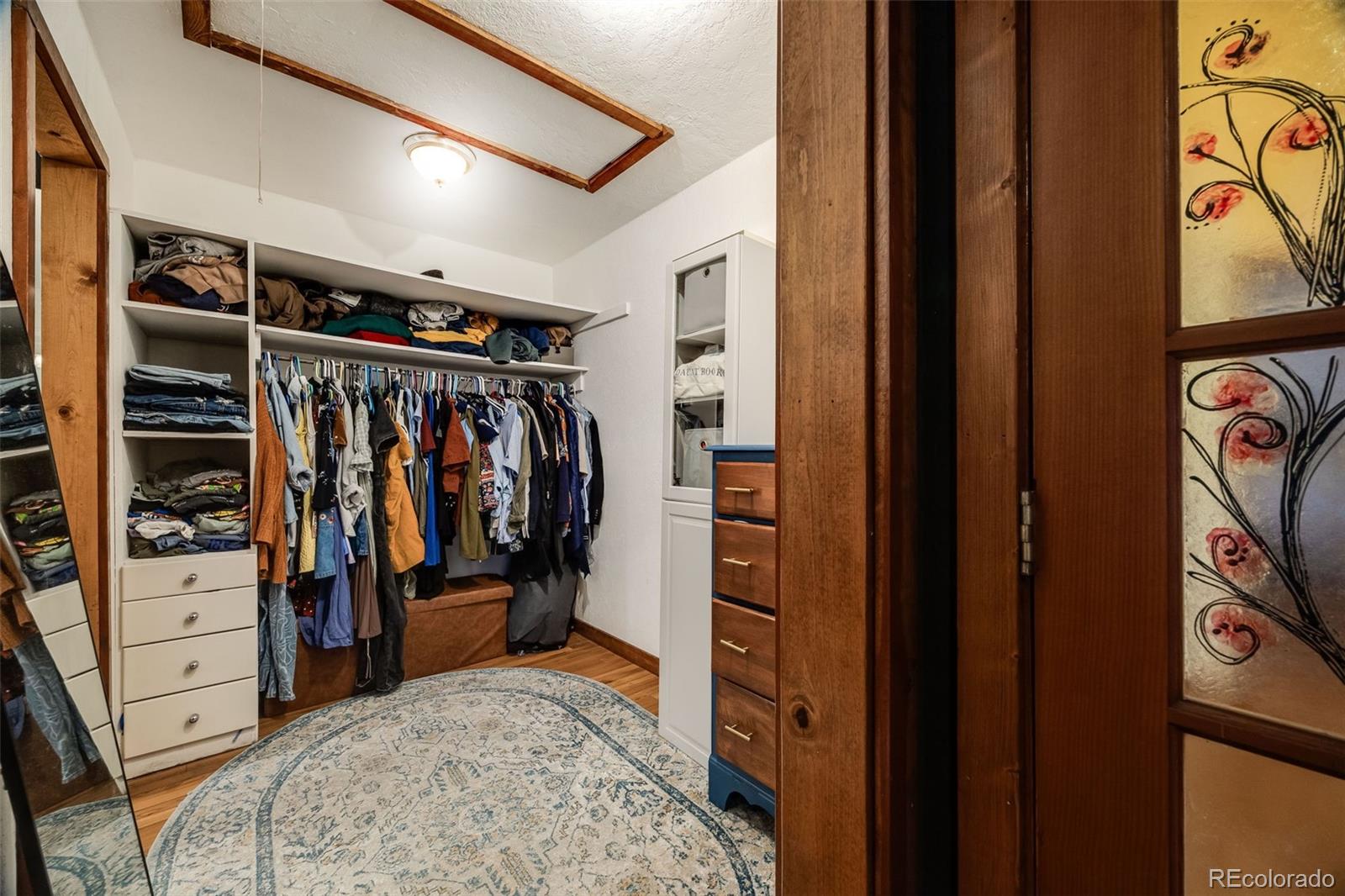46 Apache Road Evergreen, CO 80439 - Photo 32 of 46 a view of walk in closet with clothes