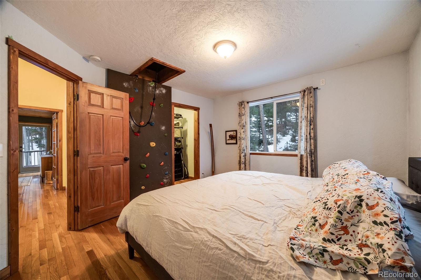 46 Apache Road Evergreen, CO 80439 - Photo 36 of 46 a bedroom with a bed and a window