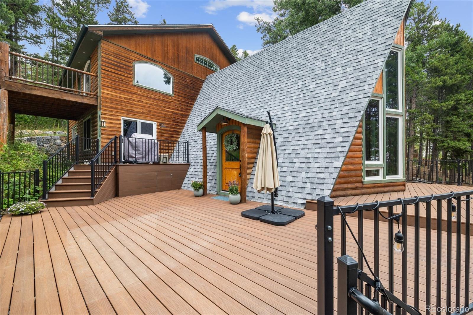 46 Apache Road Evergreen, CO 80439 - Photo 38 of 46 a view of a house with wooden floor and wooden fence