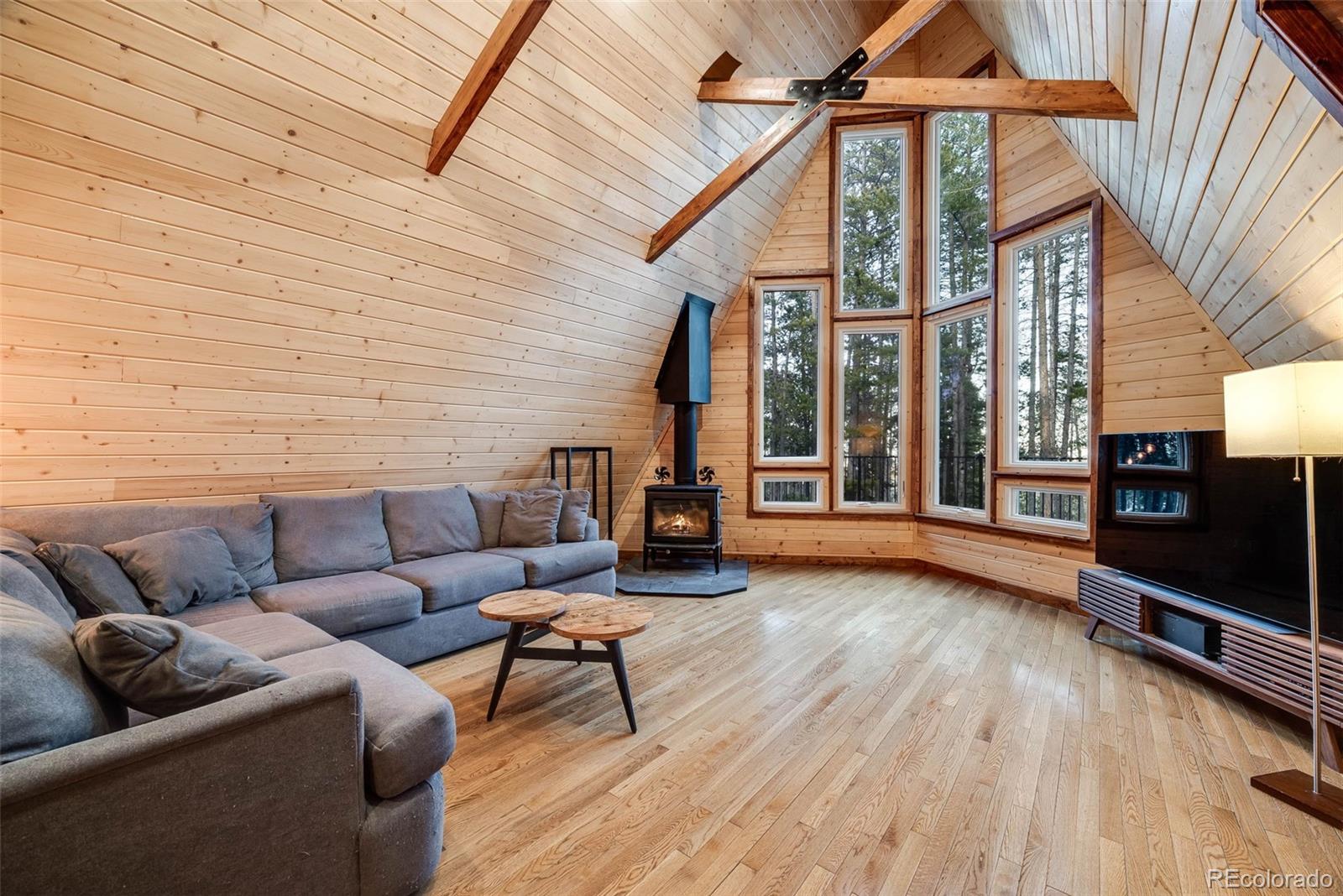 46 Apache Road Evergreen, CO 80439 - Photo 8 of 46 a view of a couches with wooden floor