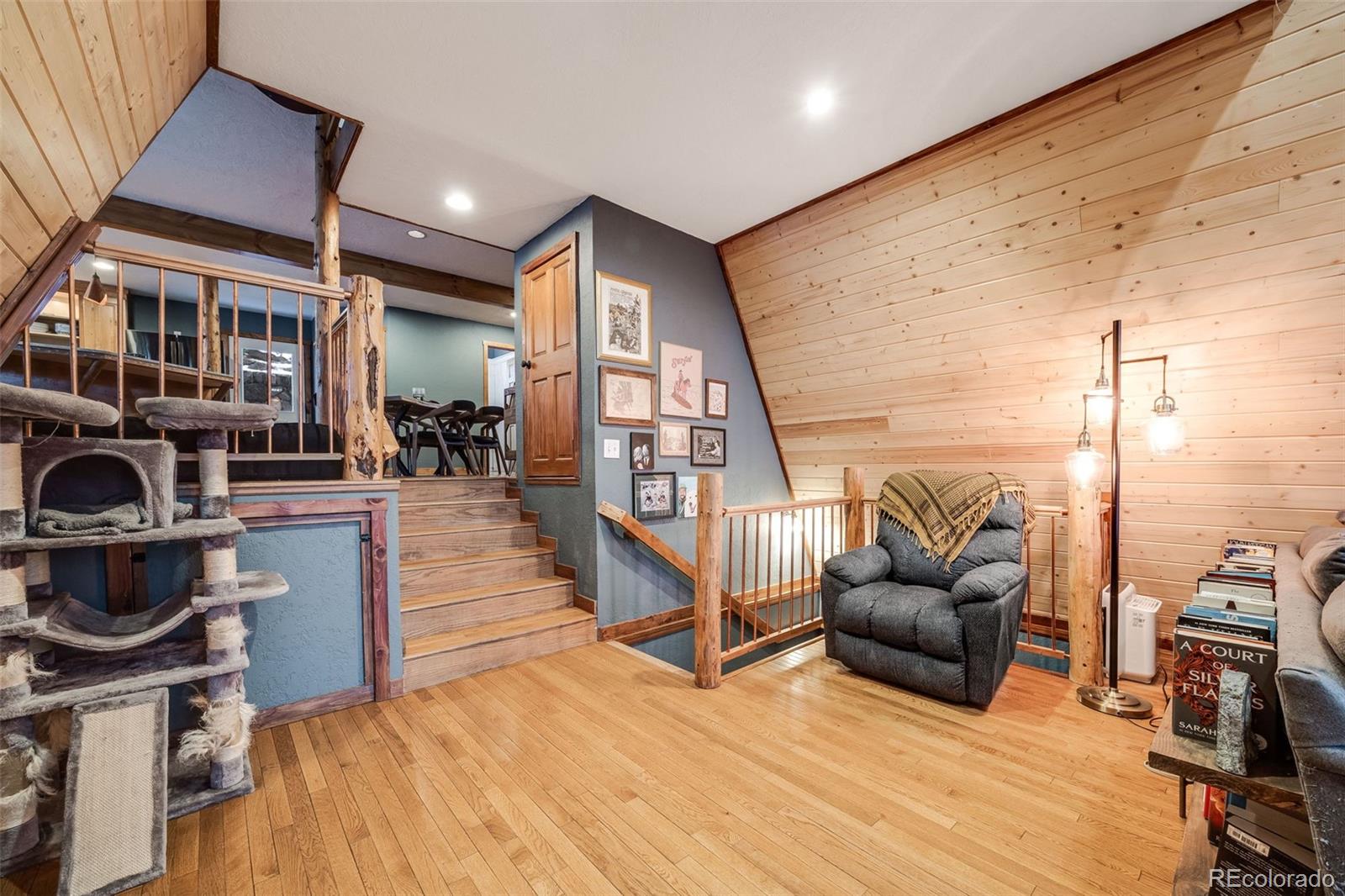 46 Apache Road Evergreen, CO 80439 - Photo 9 of 46 a living room with furniture and a fireplace