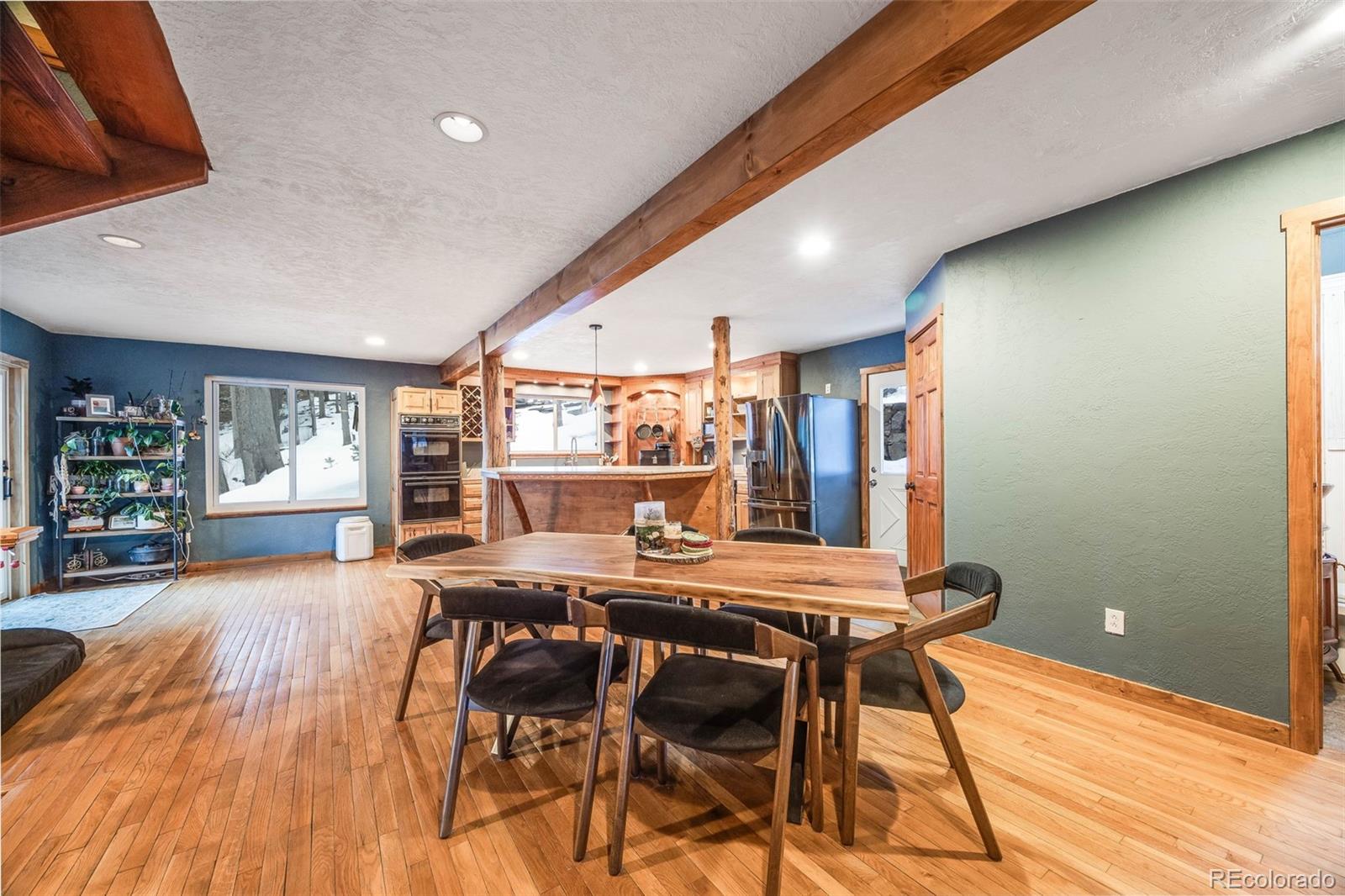 46 Apache Road Evergreen, CO 80439 - Photo 10 of 46 a view of a dining room with furniture and window