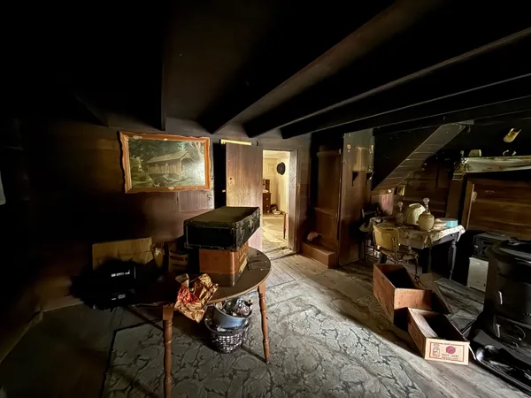 a bedroom with furniture and a window