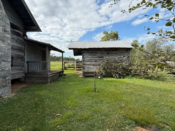 a view of a backyard of the house