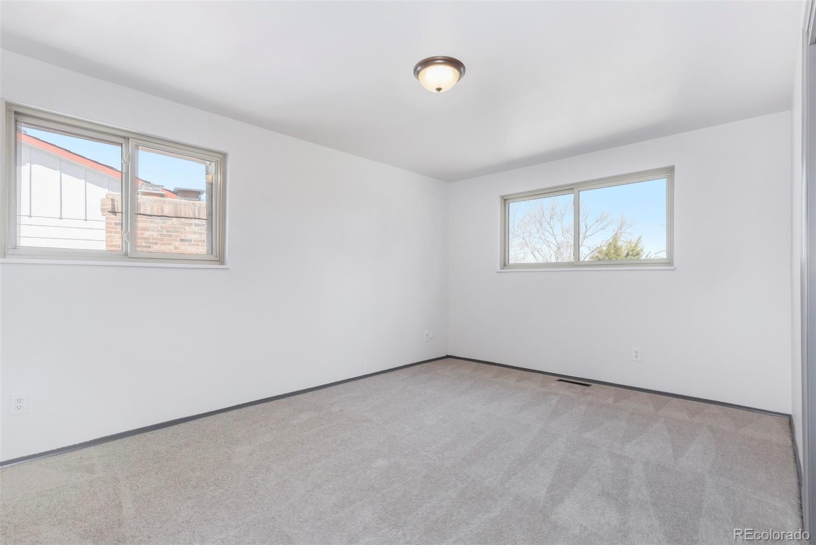 3792 South Fenton Way Denver, CO 80235 - Photo 15 of 19 an empty room with a window