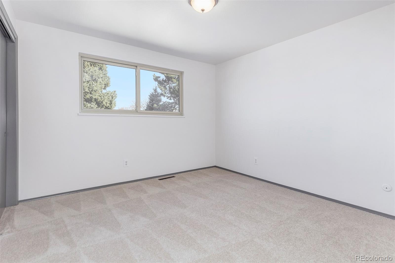 3792 South Fenton Way Denver, CO 80235 - Photo 16 of 19 an empty room with windows