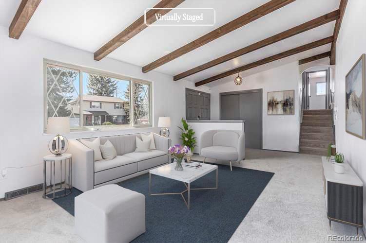 3792 South Fenton Way Denver, CO 80235 - Photo 2 of 19 a living room with furniture and a large window