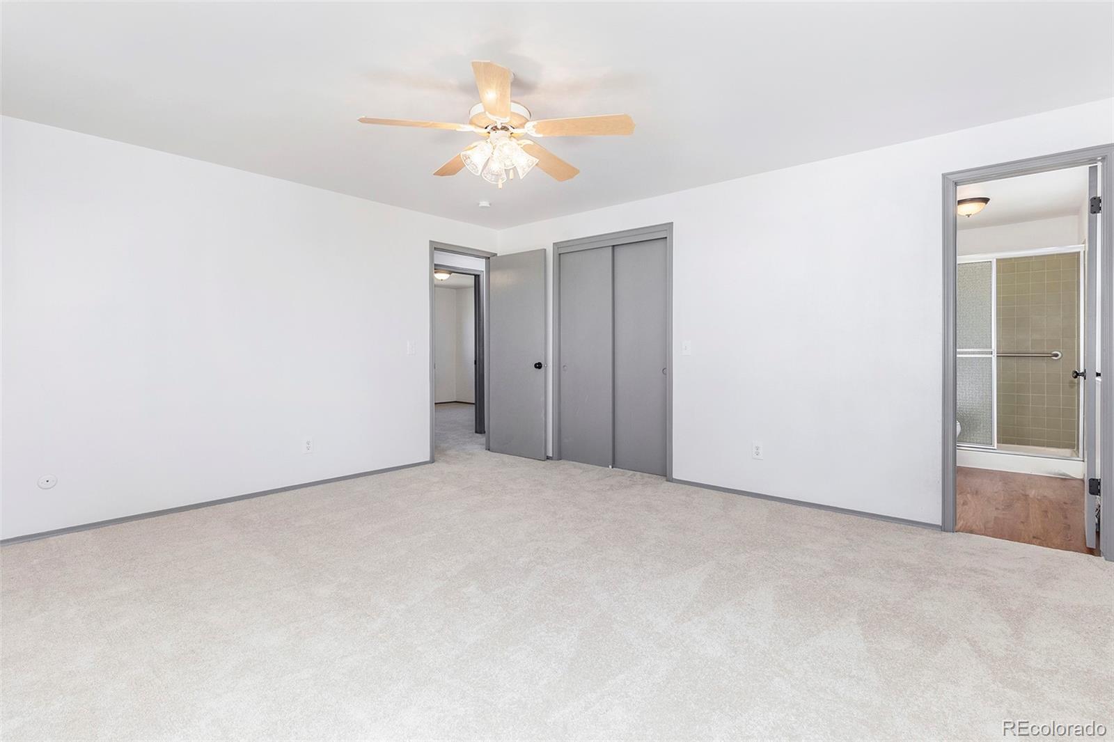 3792 South Fenton Way Denver, CO 80235 - Photo 6 of 19 an empty room with a bathroom