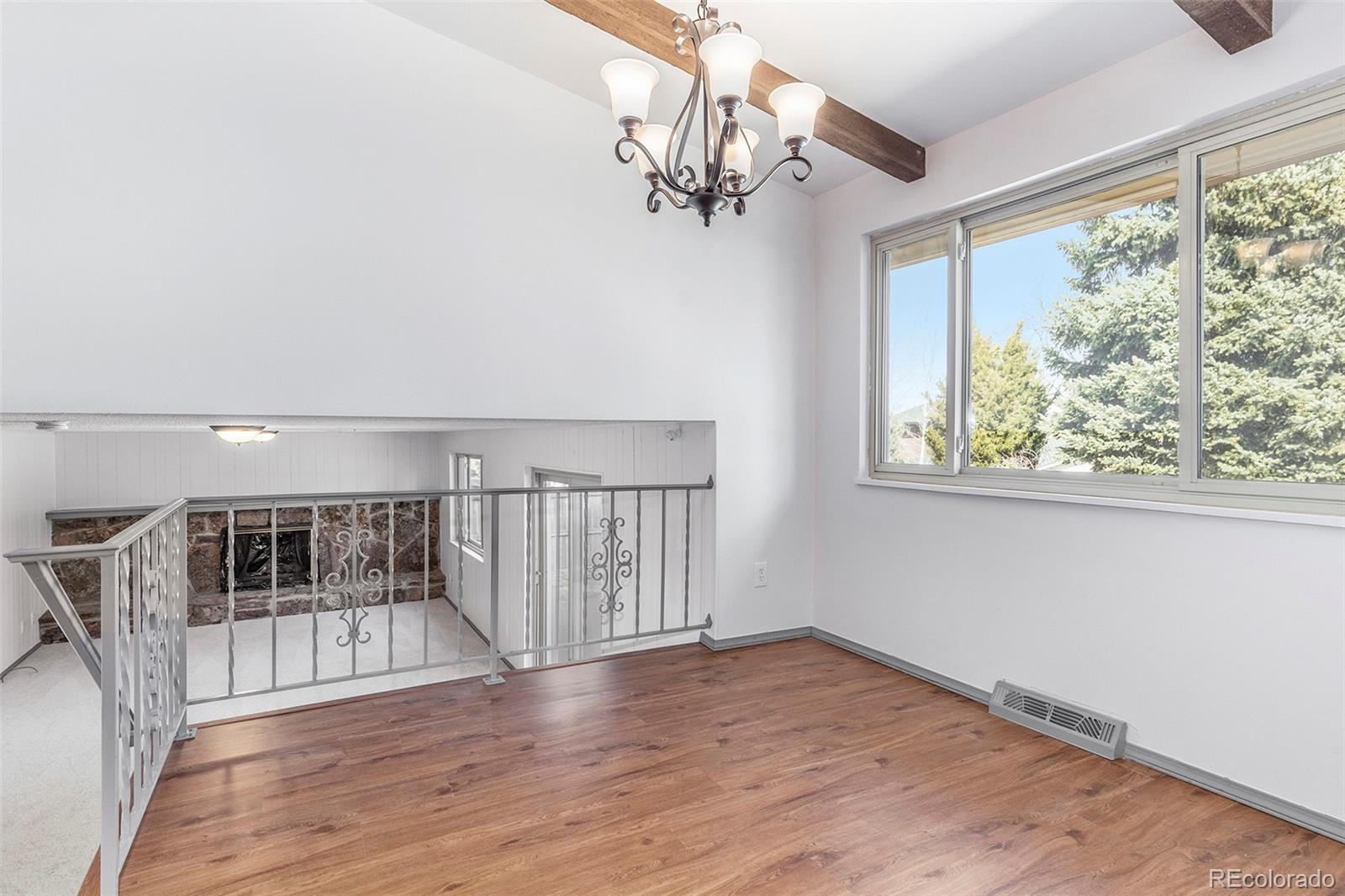 3792 South Fenton Way Denver, CO 80235 - Photo 8 of 19 a view of entryway with wooden floor