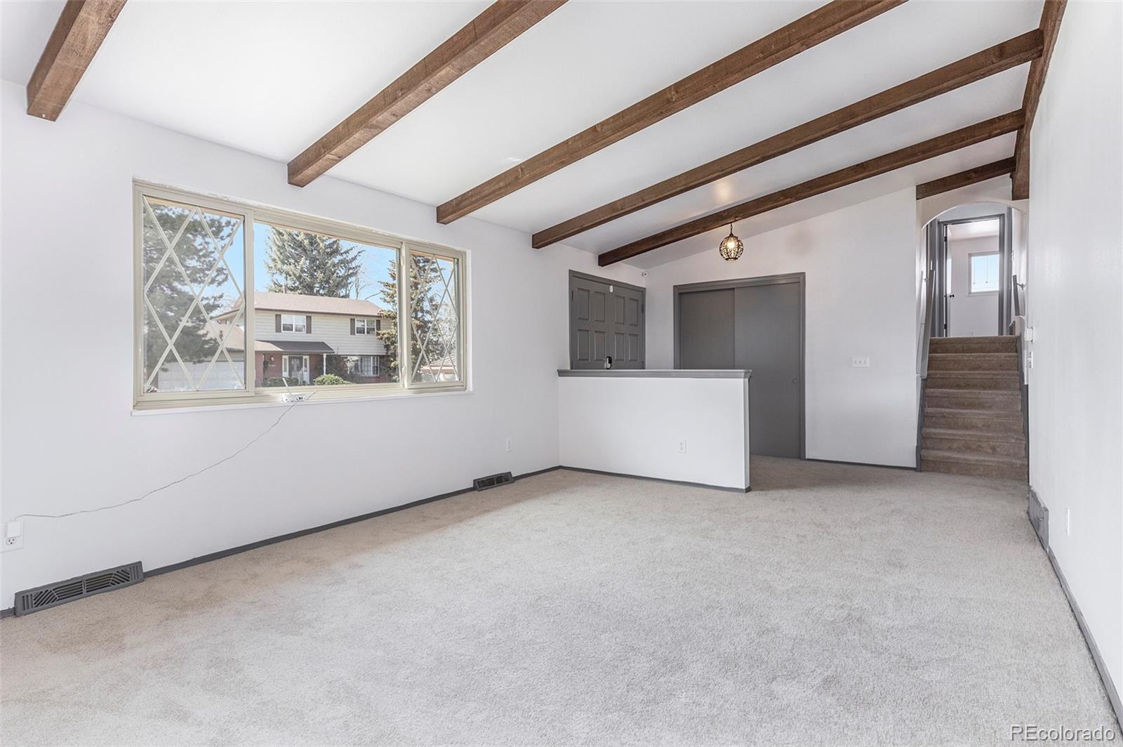 3792 South Fenton Way Denver, CO 80235 - Photo 10 of 19 an empty room with windows