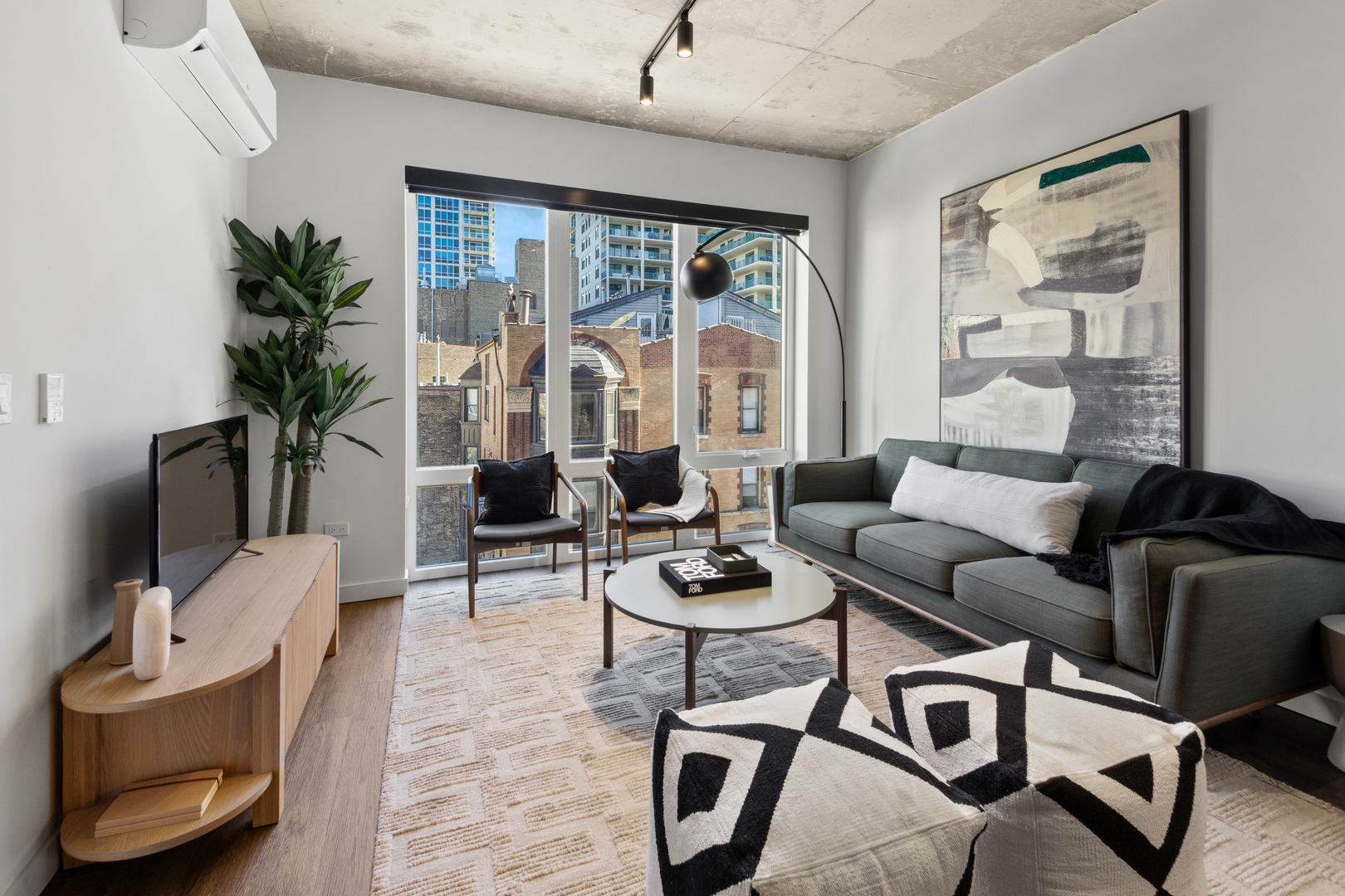 411 West Chicago Avenue, Unit C806 Chicago, IL 60654 - Photo 4 of 16 a living room with furniture and a large window