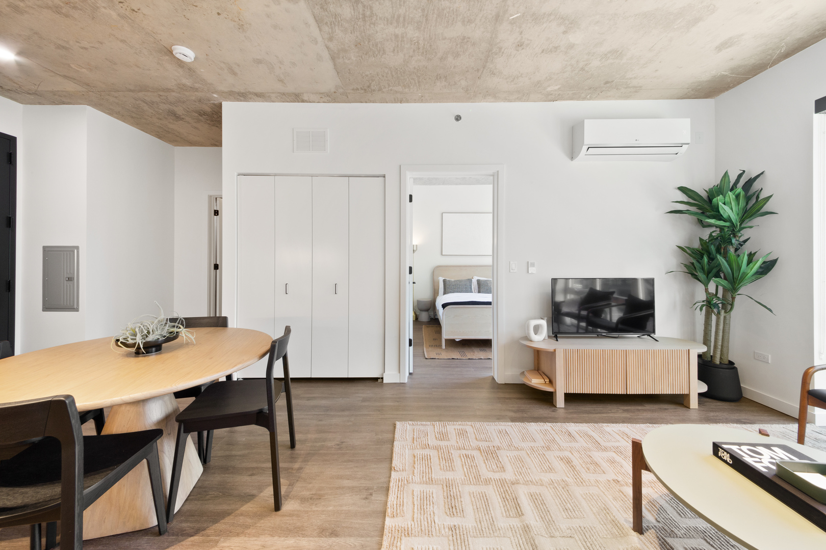 411 West Chicago Avenue, Unit C806 Chicago, IL 60654 - Photo 8 of 16 a living room with furniture and a table