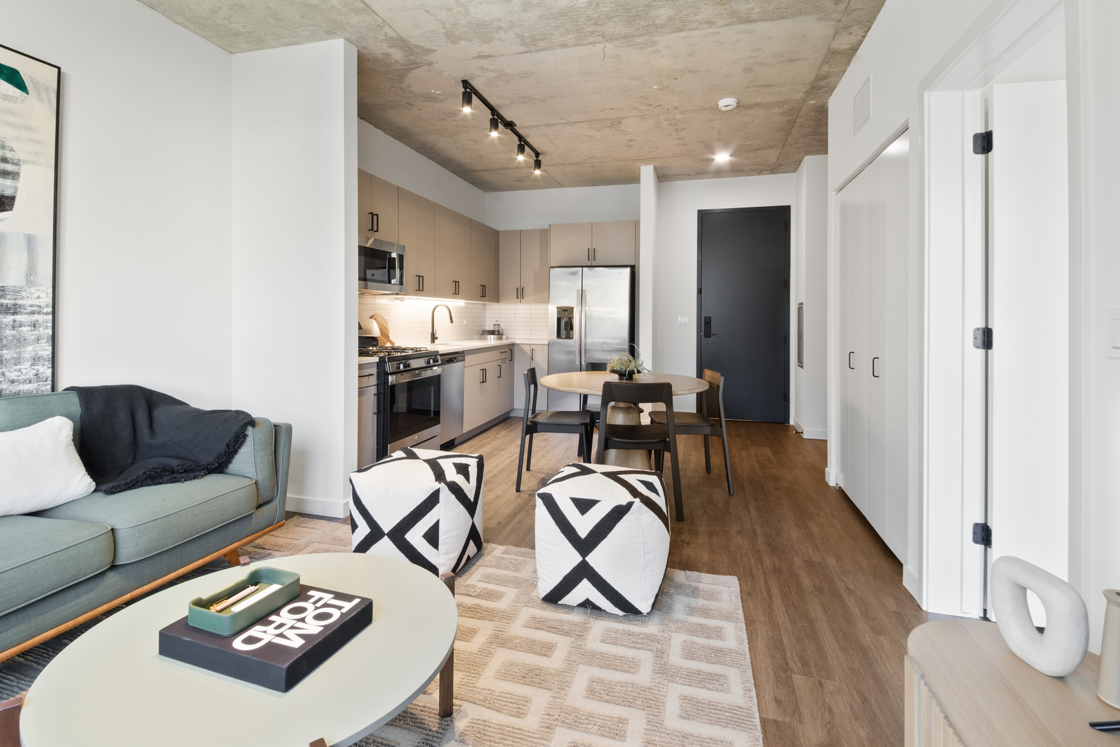 411 West Chicago Avenue, Unit C806 Chicago, IL 60654 - Photo 9 of 16 a view of a livingroom with furniture and a table