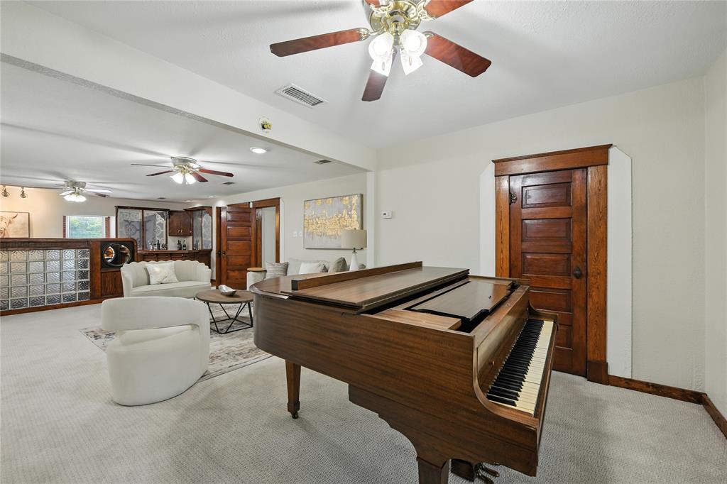 1323 Dublin Street Grapevine, TX 76051 - Photo 13 of 40 a living room with furniture and a chandelier