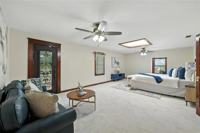 a living room with furniture flowerpot and window