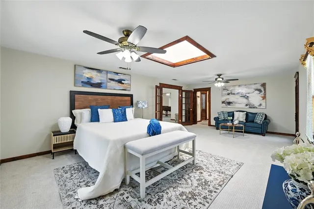 a bedroom with a bed furniture and a window