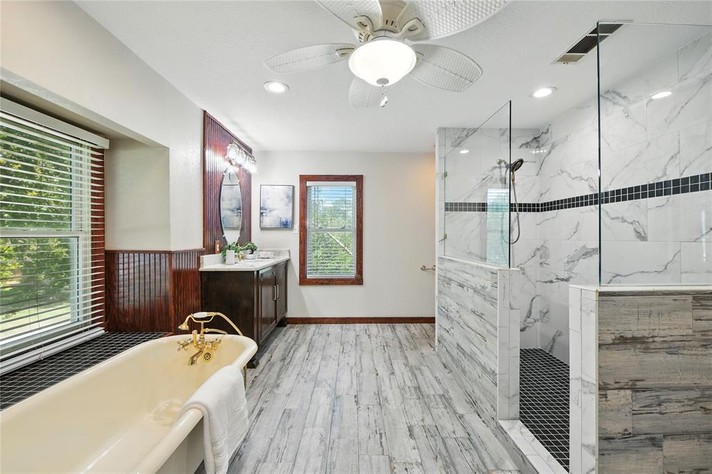 1323 Dublin Street Grapevine, TX 76051 - Photo 17 of 40 a spacious bathroom with a tub sink and mirror
