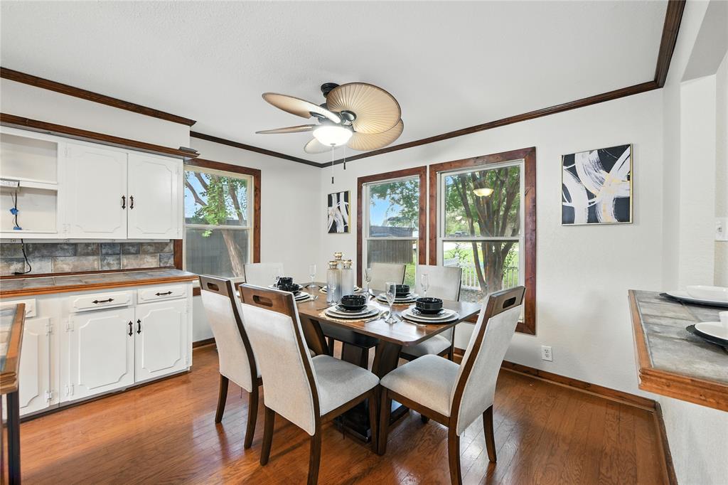 1323 Dublin Street Grapevine, TX 76051 - Photo 30 of 40 a dining room with furniture a chandelier and wooden floor