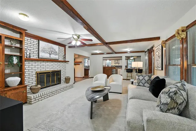 a living room with hard wood flooring and a couch