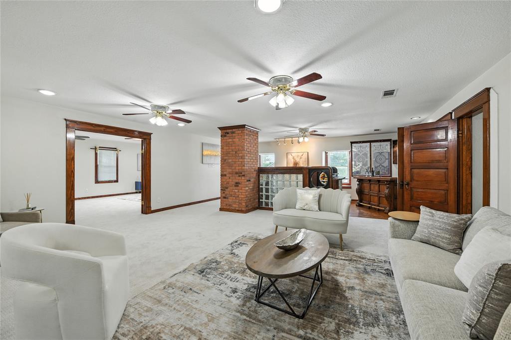 1323 Dublin Street Grapevine, TX 76051 - Photo 4 of 40 a living room with furniture and a chandelier