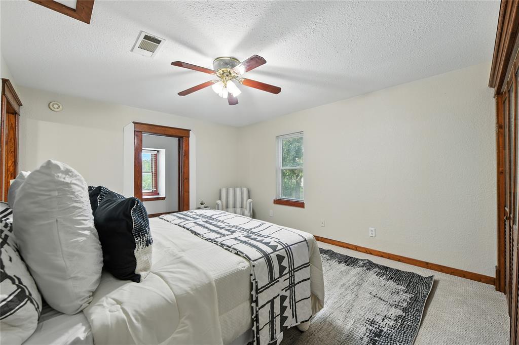 1323 Dublin Street Grapevine, TX 76051 - Photo 7 of 40 a bedroom with a bed and a window