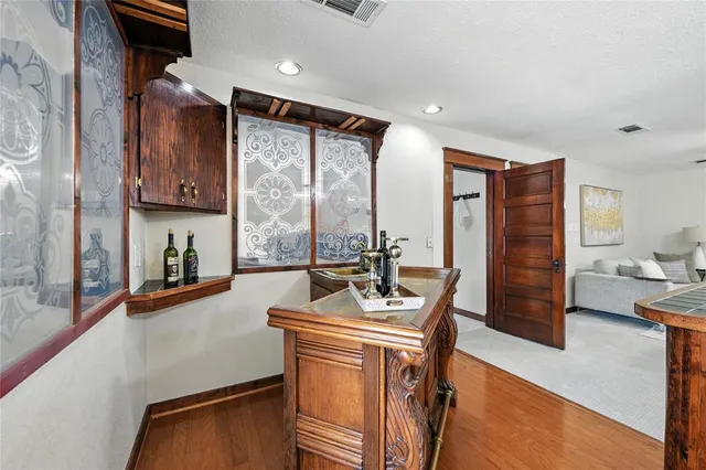 a living room with furniture and a ceiling fan
