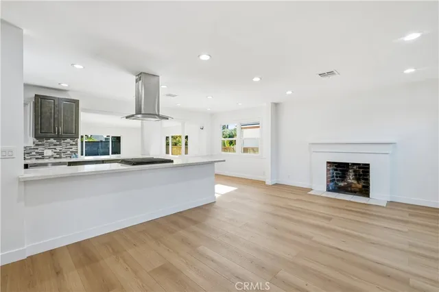 a view of kitchen with cabinets and wooden floor