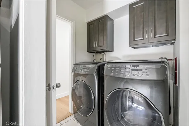 a close view of utility room with washer and dryer