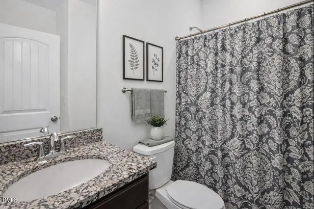 a bedroom with a large bed and a couch