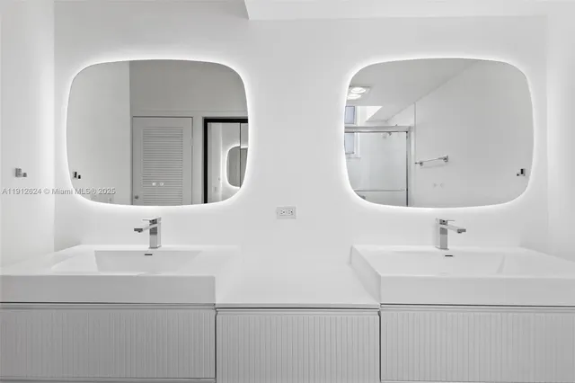 a bathroom with a sink a toilet and a shower