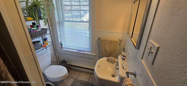 a view of a livingroom with furniture and hardwood floor