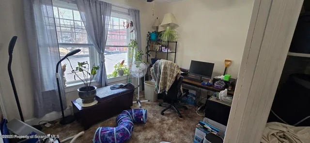 a view of entryway and workspace