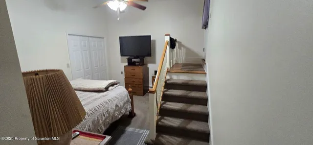 a kitchen with a refrigerator and cabinets