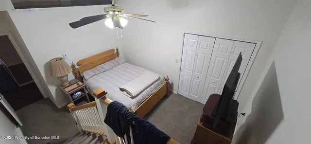 a kitchen with stainless steel appliances a white refrigerator a stove top oven a counter space and cabinets