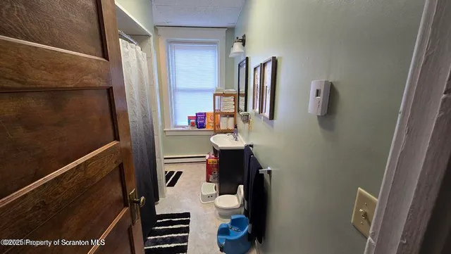 a bedroom with furniture and a window