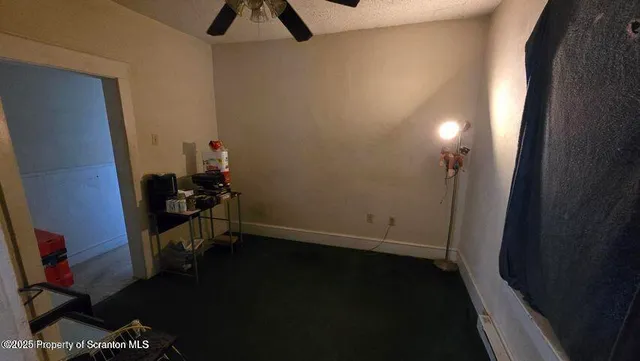 a kitchen with a refrigerator and cabinets