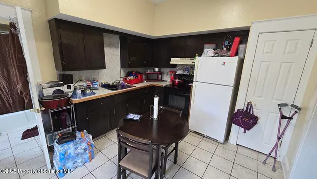 a view of a hallway with furniture