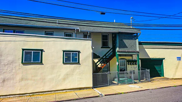 a kitchen with a refrigerator and cabinets