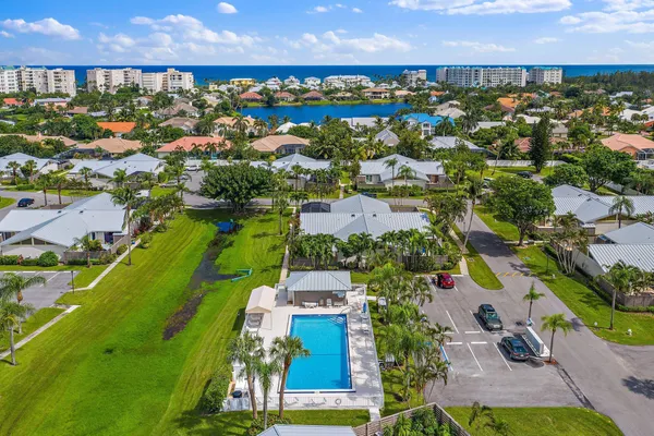 an aerial view of residential building and ocean